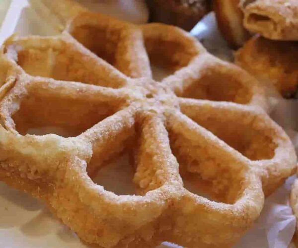 El origen y la receta de los buñuelos de viento: El arte de freír el aire